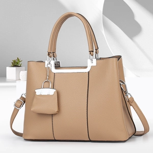 Elegant khaki lychee grain leather tote bag with silver hardware and mini pouch charm