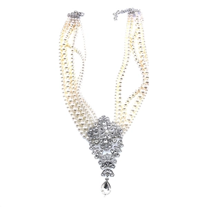 Statement layered pearl and crystal drop choker necklace for women on white background
