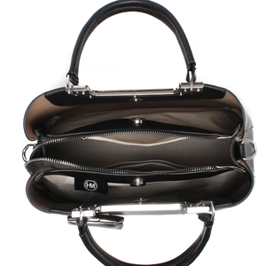 Internal view of the black leather shoulder bag showing the multi-compartment lining