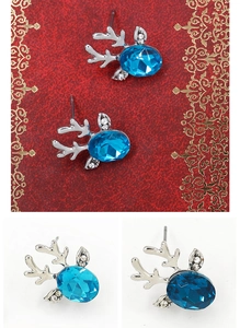 Detail of reindeer stud earrings with blue oval gemstone and silver antlers