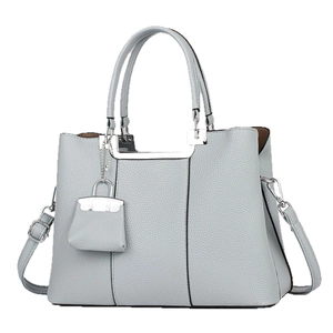 Elegant light blue lychee pattern leather handbag with silver hardware and mini pouch