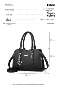 Detailed dimension guide for black textured handbag with golden heart pearl charm