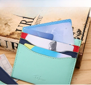 Mint green crossgrain leather card holder with six card slots and one main compartment