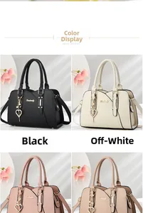 Detail view of large heart charm handbags in black, white, pink and apricot colors