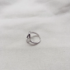 Macro shot of S925 sterling silver stamp on minimalist hollow geometric open ring