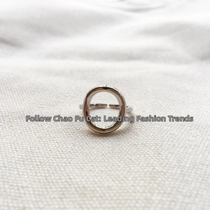Detail of polished S925 sterling silver open ring featuring a hollow geometric circle