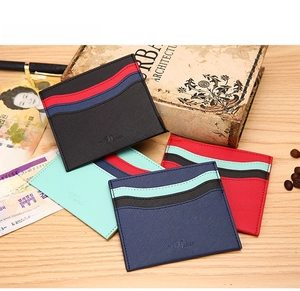 Close-up of slim Saffiano leather card holders with unique wave-edge pockets in four colors