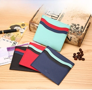 Slim cross-grain leather card holder with wave-shaped slots in four elegant colors