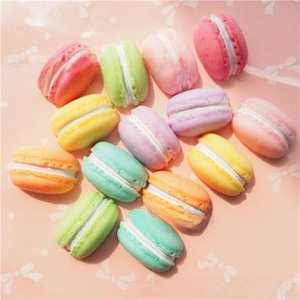 Flat lay of colorful miniature resin macarons for DIY crafts and phone case decoration