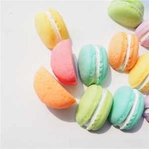 Macro view of colorful resin macaron charms showing realistic texture and creamy filling