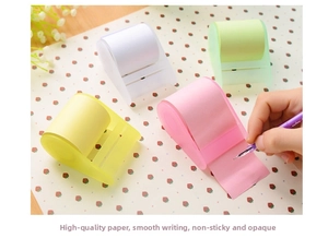 Macro view of colorful roll sticky notes set with a translucent dispenser base