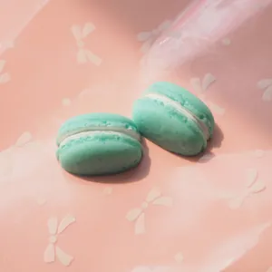 Detailed view of realistic resin mint green macaron accessory for DIY cream phone case crafting