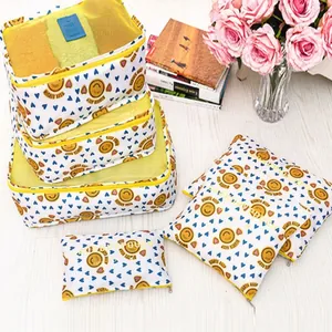 6-piece travel organizer set with yellow smiley and blue heart patterns on white fabric