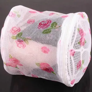 Cylindrical mesh laundry bag with floral rose print and zipper for washing machine