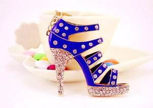 Detail of blue enamel high heel keychain with sparkling rhinestones and gold metal accents