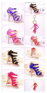 Detailed close-up of high heel rhinestone keychains in purple black red and rose colors