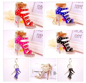 Detail of assorted rhinestone high heel shoe keychains in various colors and patterns