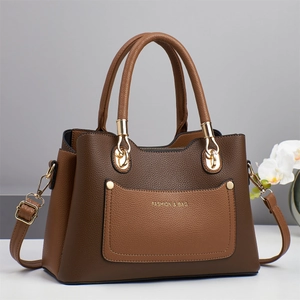 Brown litchi leather shoulder bag with top handles and gold hardware details