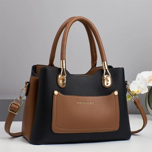 Minimalist color-block leather tote bag with large capacity and elegant gold hardware