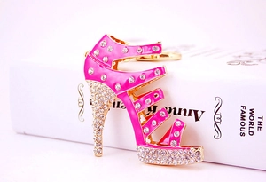 Detail of creative pink high heel keychain with sparkling rhinestones and metal pendant