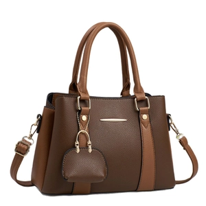 Dual-tone brown lychee pattern leather handbag with gold hardware and shoulder strap
