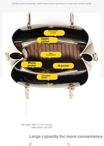 Innenansicht der Fächer und des gestreiften Stofffutters dieser eleganten Handtasche