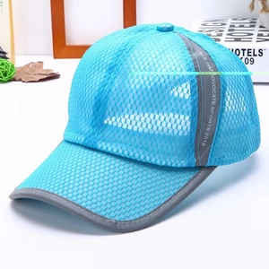 Detail of bright blue mesh baseball cap with breathable polyester and reflective trim