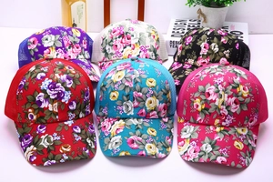 Detail showing various colors of floral canvas baseball caps with breathable mesh back