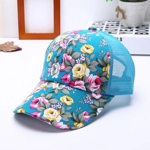 Detailed macro view of sky blue floral pattern and mesh fabric on a baseball cap