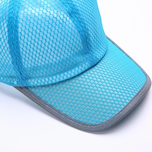 Detail of light blue mesh baseball cap showing breathable fabric and reflective brim trim
