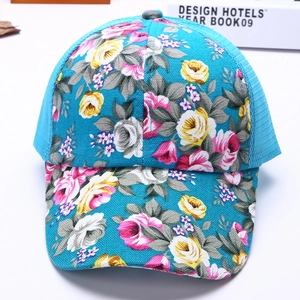 Detailed view of pink floral print and blue breathable mesh on the summer baseball cap