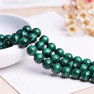 Natural malachite round beads for DIY jewelry with green banded texture and glossy finish