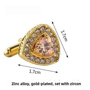 Macro shot of 17mm gold-plated heart cufflinks with champagne zircon and size annotations