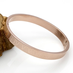Rose gold stainless steel bangle with engraved Roman numerals and side hinge closure