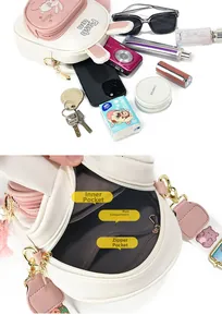 Detail view of mini rabbit backpack interior showing main pocket and zipper compartments