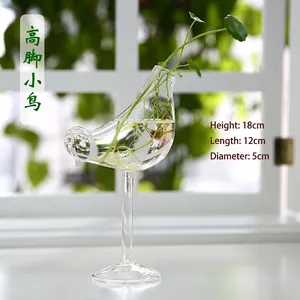 Detailed view of bird-shaped glass vase with dimensions 18cm height and 12cm length