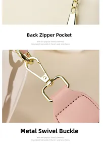 Detail of soft leather texture with gold metal zippers and detachable strap hooks