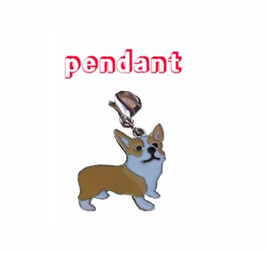 Detail view of a Corgi dog enamel pendant with silver lobster clasp for keychains