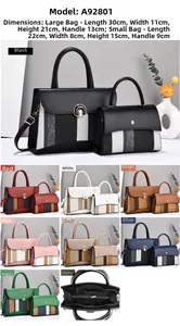 Close-up of dual-size handbag set featuring stylish metal flap lock and striped design