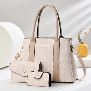 Three-piece beige monogram tote bag set including wallet and pouch for women