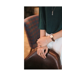 Close-up of s925 silver layered bracelet and vintage watch on model wrist