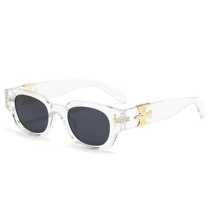 Fashion oval sunglasses with clear crystal frame and gold eagle sword temple details