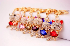Detailed set of sparkling rhinestone lucky cat keychains in seven vibrant colors