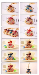 Detailed grid view of crystal flying pig keychains in various vibrant rhinestone colors