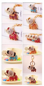Macro shot showing crystal elephant keychains with colorful rhinestones and gold hardware