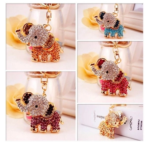Detail shots of various rhinestone-encrusted elephant keychains in multi-color metal finishes