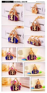 Detail of colorful handbag shaped metal keychains with rhinestones and enamel finish