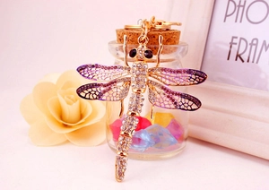 Detail showing gradient purple wings and sparkling rhinestones on dragonfly keychain