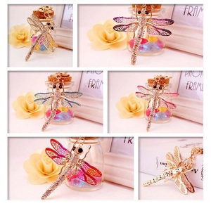 Collage of colorful metal dragonfly keychains with sparkling rhinestones in various shades