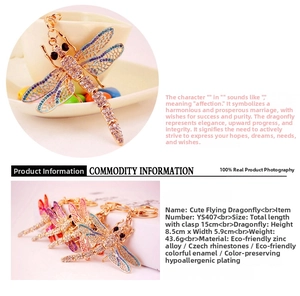 Detailed macro view of the colorful enamel dragonfly keychain with sparkling rhinestones